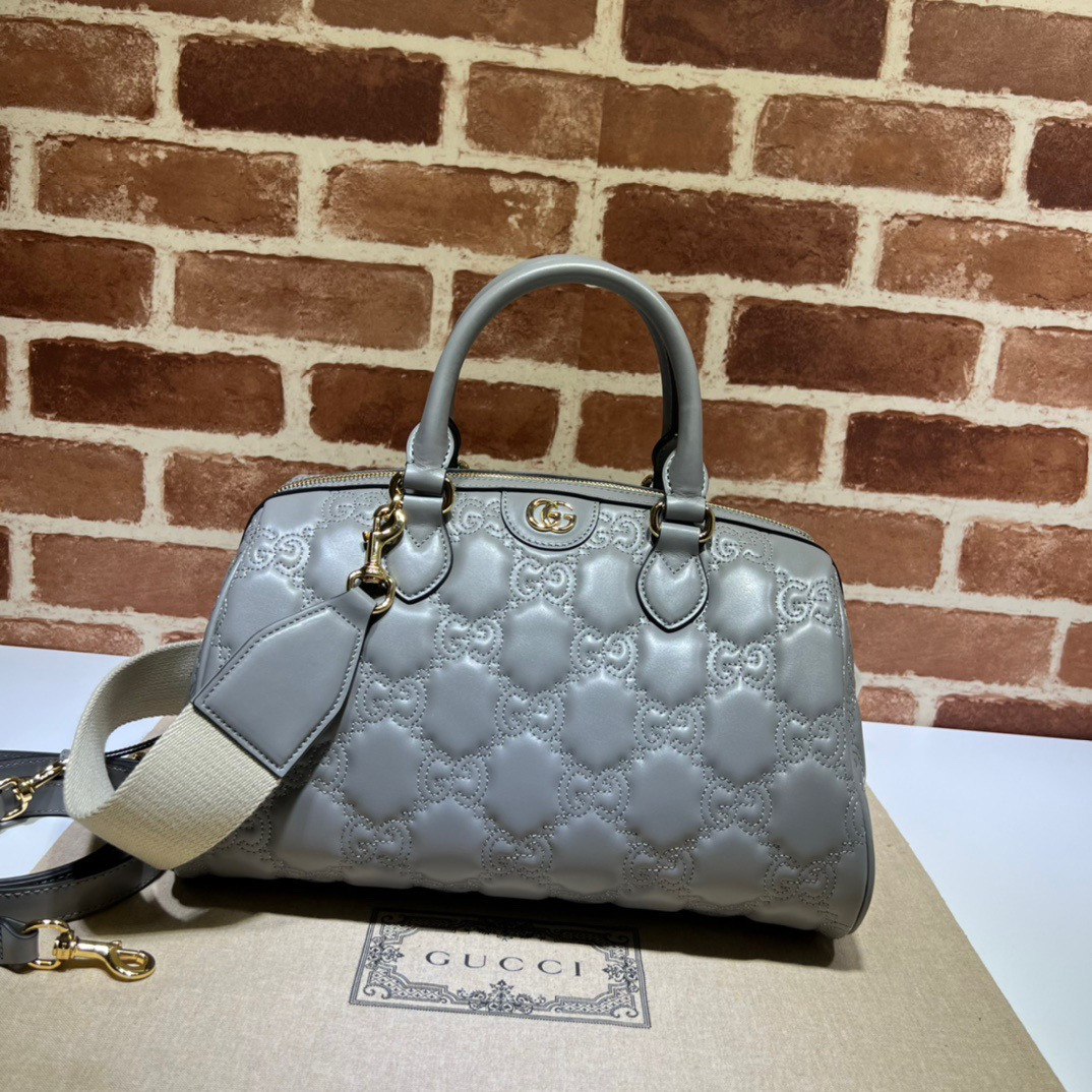 G*u*i gg matelassé leather top handle bag