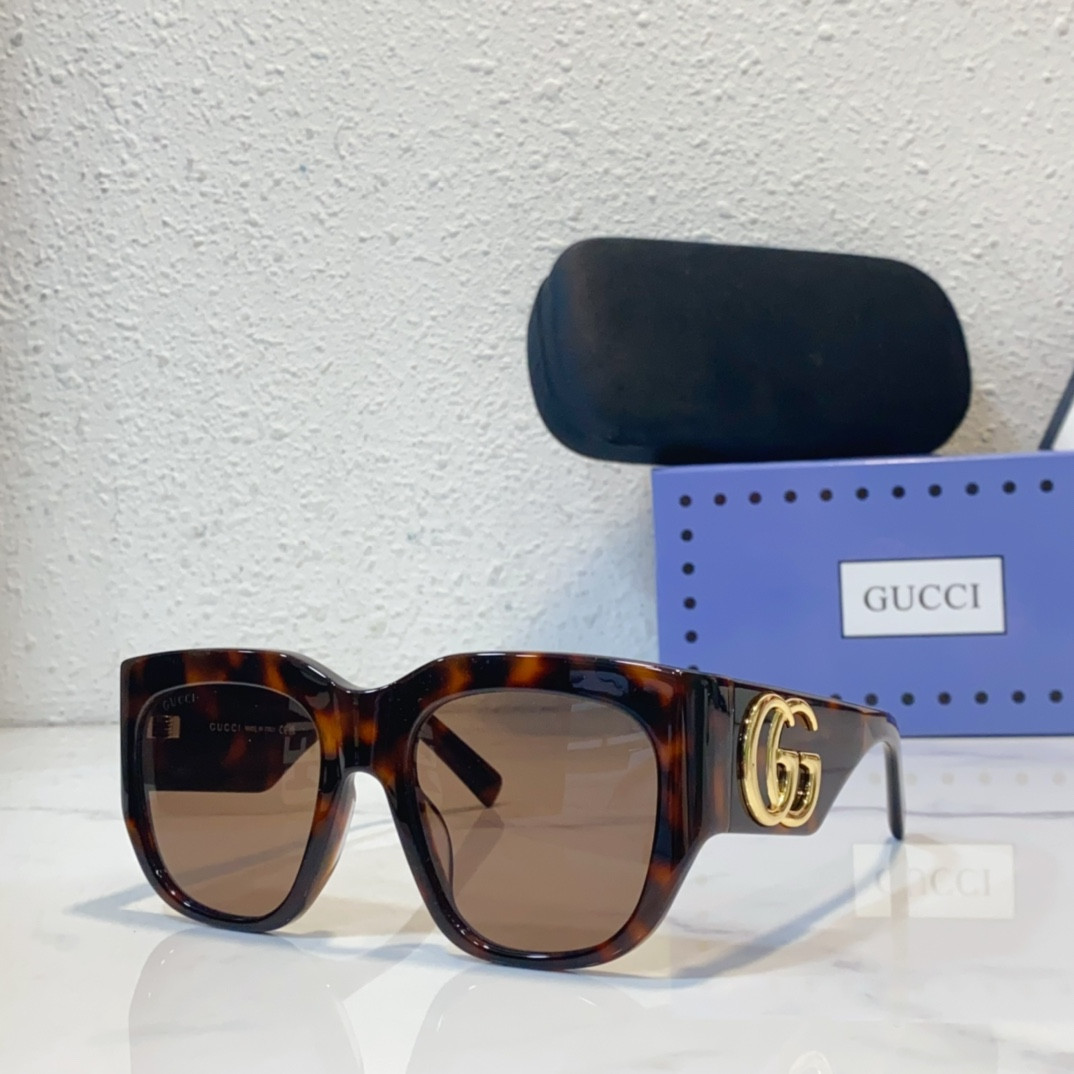 G*u*i sunglasses